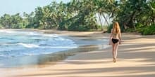 Tourist taking a beach stroll